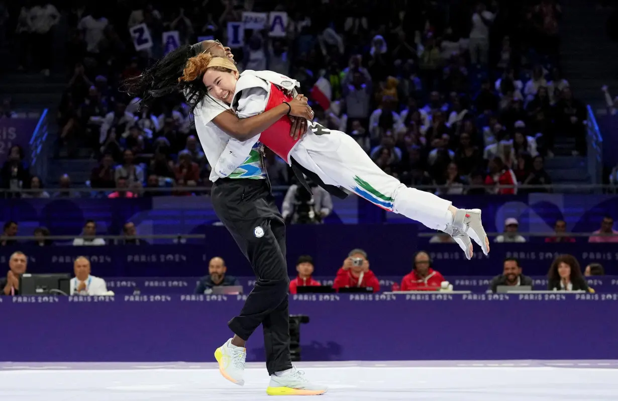 Zakia Khudadadi makes history by winning first-ever Paralympic medal for the refugee team with taekwondo bronze