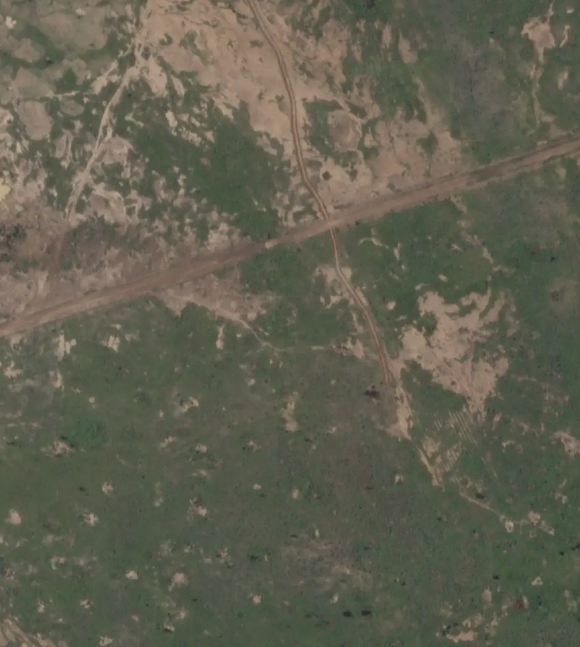 A satellite image shows a newly-built trench near Barsalogho