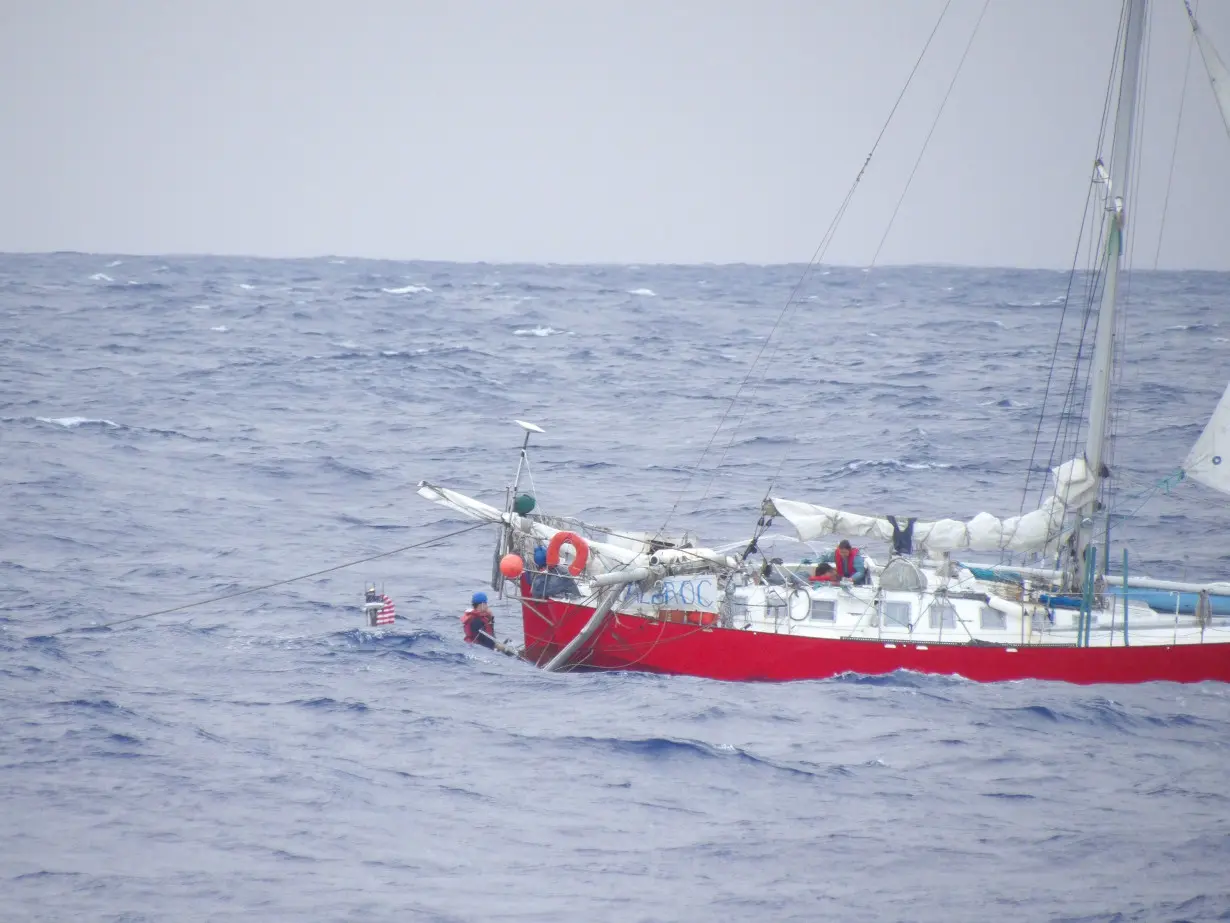 A small boat crew assigned to the USS William P. Lawrence conducted the rescue mission for the woman, child and pets onboard the French-flagged sailing vessel Albroc.