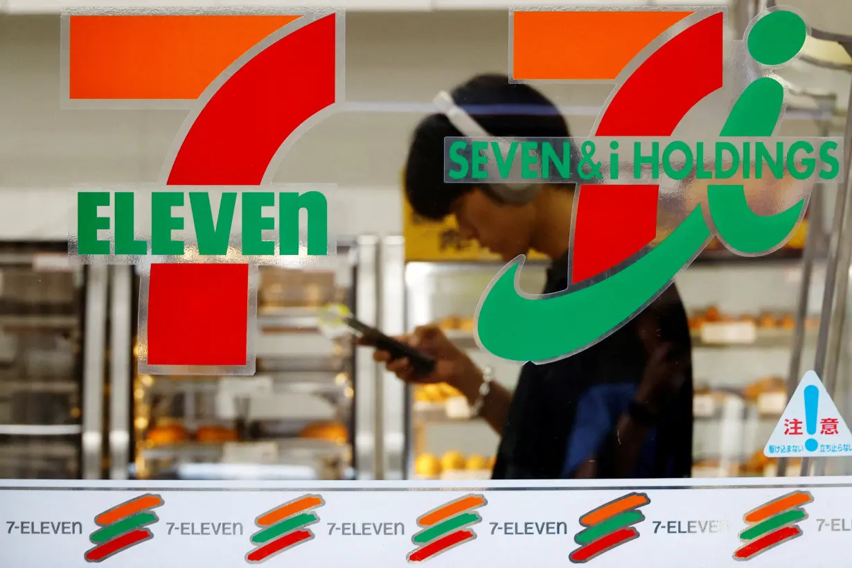 FILE PHOTO: Japan's Seven & i's logo is seen at its 7-Eleven convenience store in Tokyo