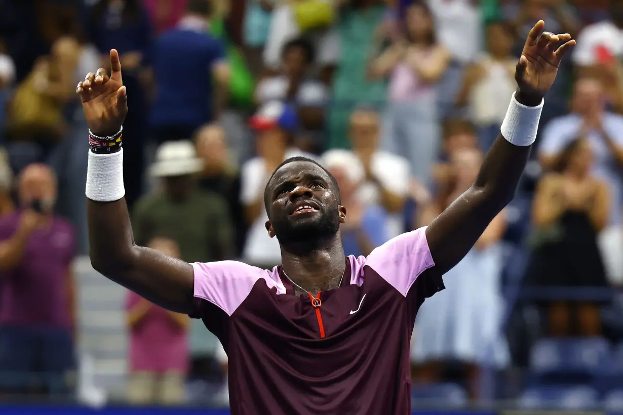 Tiafoe celebrates after defeating Rafael Nadal in the fourth round of the US Open in September 2022.