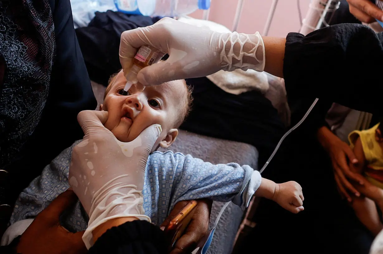 A child is vaccinated against polio in Khan Younis.