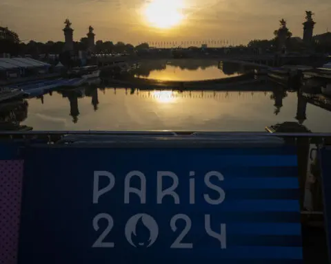 Paralympic triathlon events are postponed for a day because of poor water quality in the Seine River