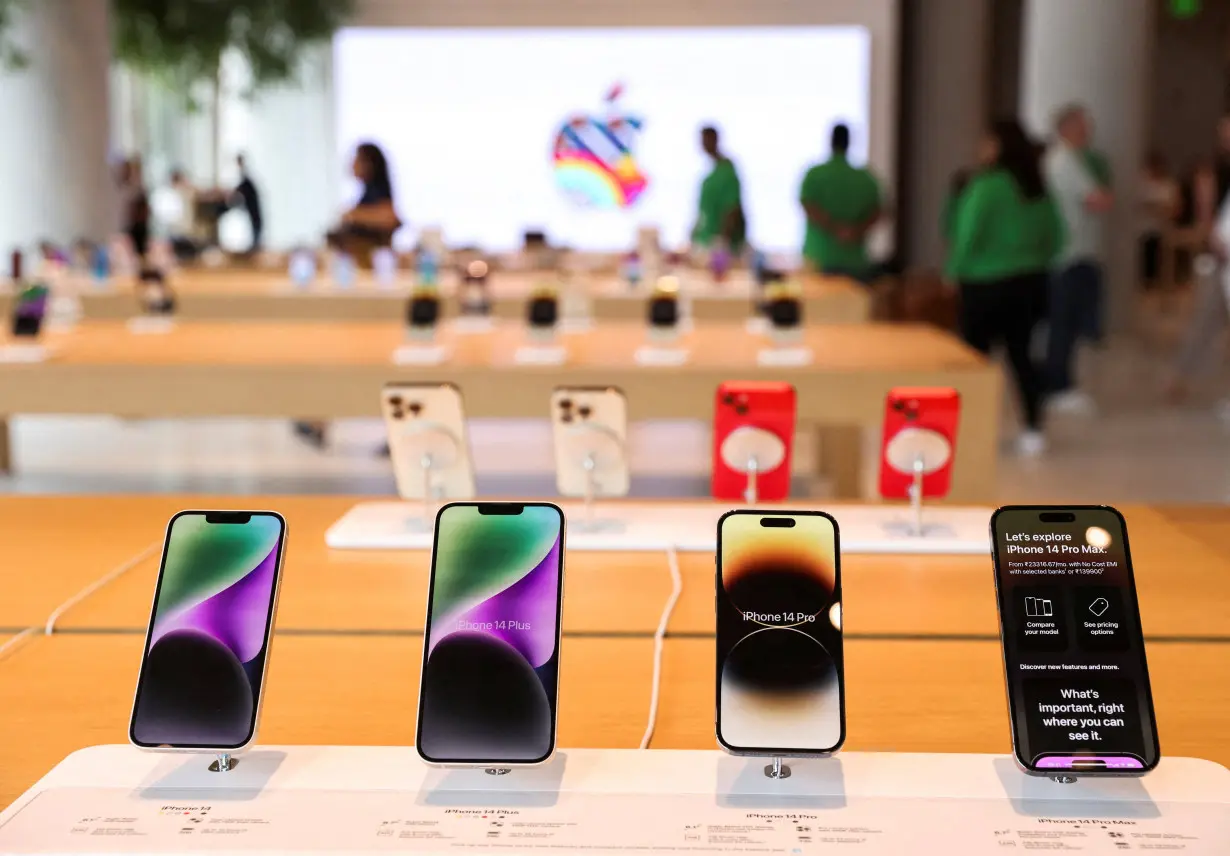 FILE PHOTO: Apple iPhones are seen inside India's first Apple retail store, a day ahead of its launch, in Mumbai