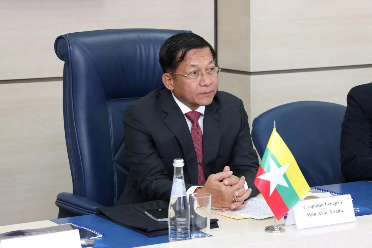 FILE PHOTO: Myanmar's Prime Minister and State Administrative Council Chairman Min Aung Hlaing attends a meeting with Director General of Roscosmos Dmitry Rogozin in Moscow