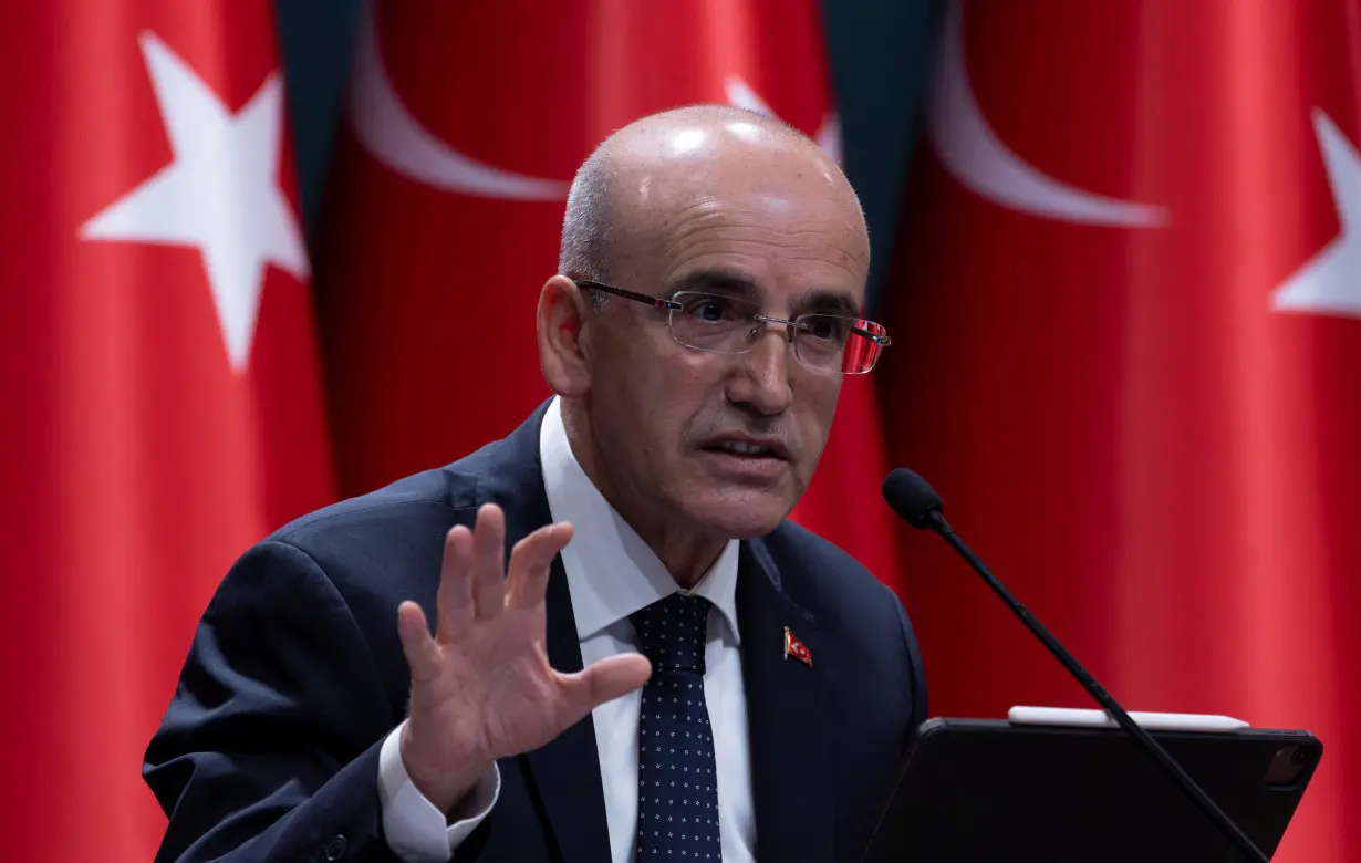 Turkey's Finance Minister Mehmet Simsek announces a savings measures package in Ankara