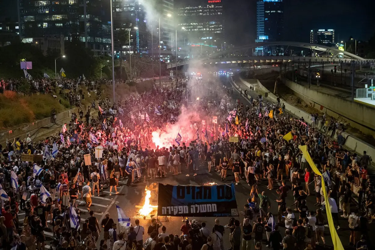 Israeli protestors block the Ayalon freeway during a mass protest in Tel Aviv, Israel on September 1.