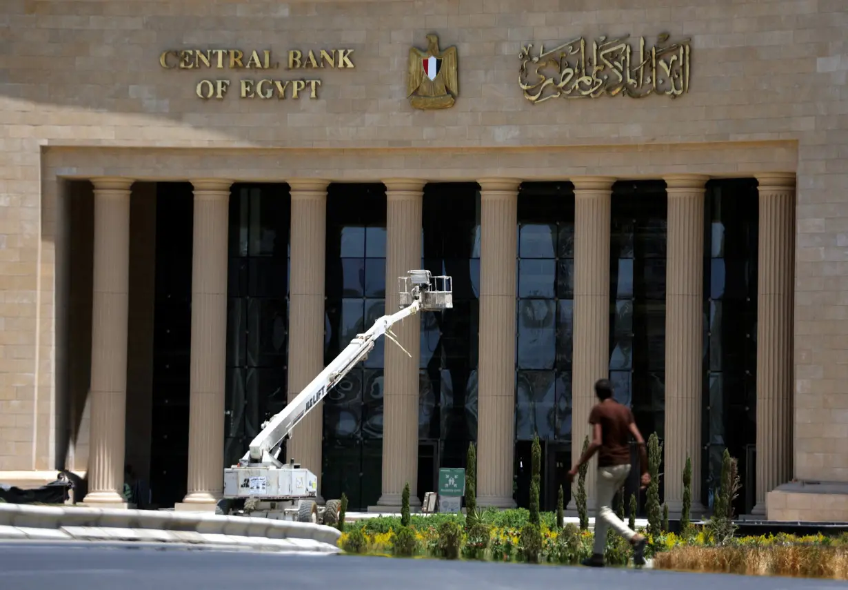 A man walks in front of the new headquarters of Central Bank of Egypt, at the New Administrative Capital (NAC) east of Cairo