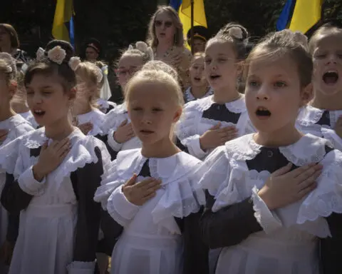 Ukraine's children return to school as Russia launches drones and ballistic missiles at Kyiv