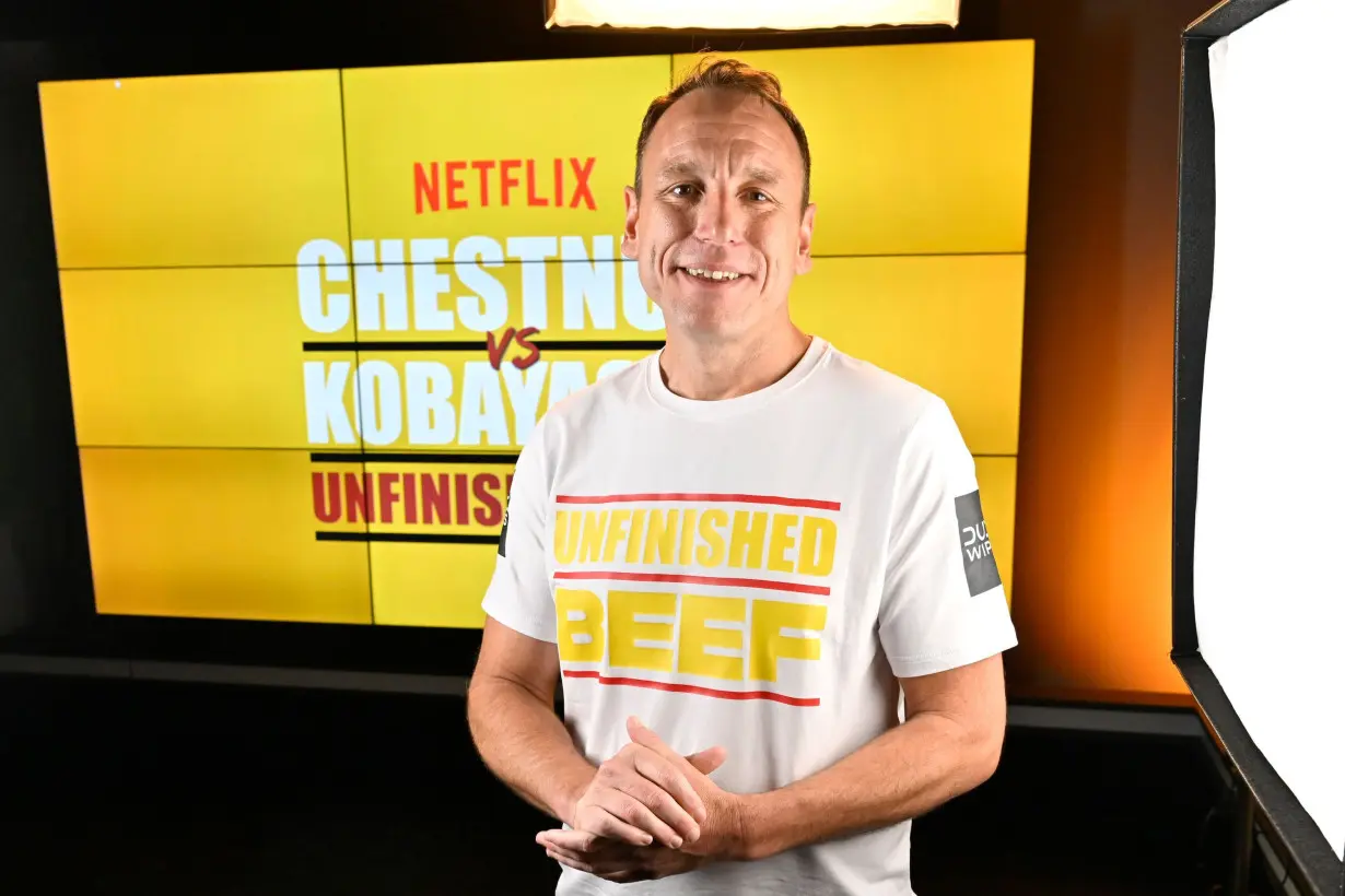 Joey Chestnut breaks own world record, beating rival Takeru Kobayashi in Netflix's hot dog eating showdown