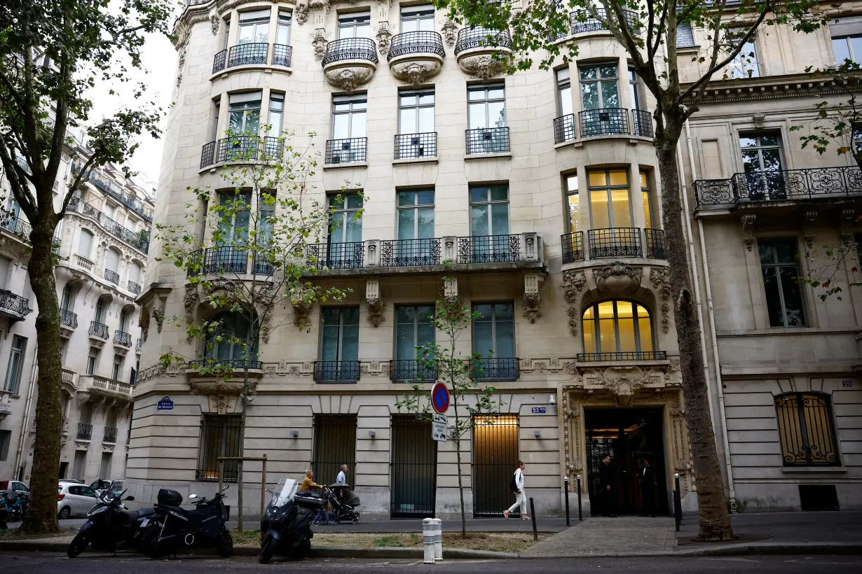 People walk past the Rothschild & Co headquarters in Paris