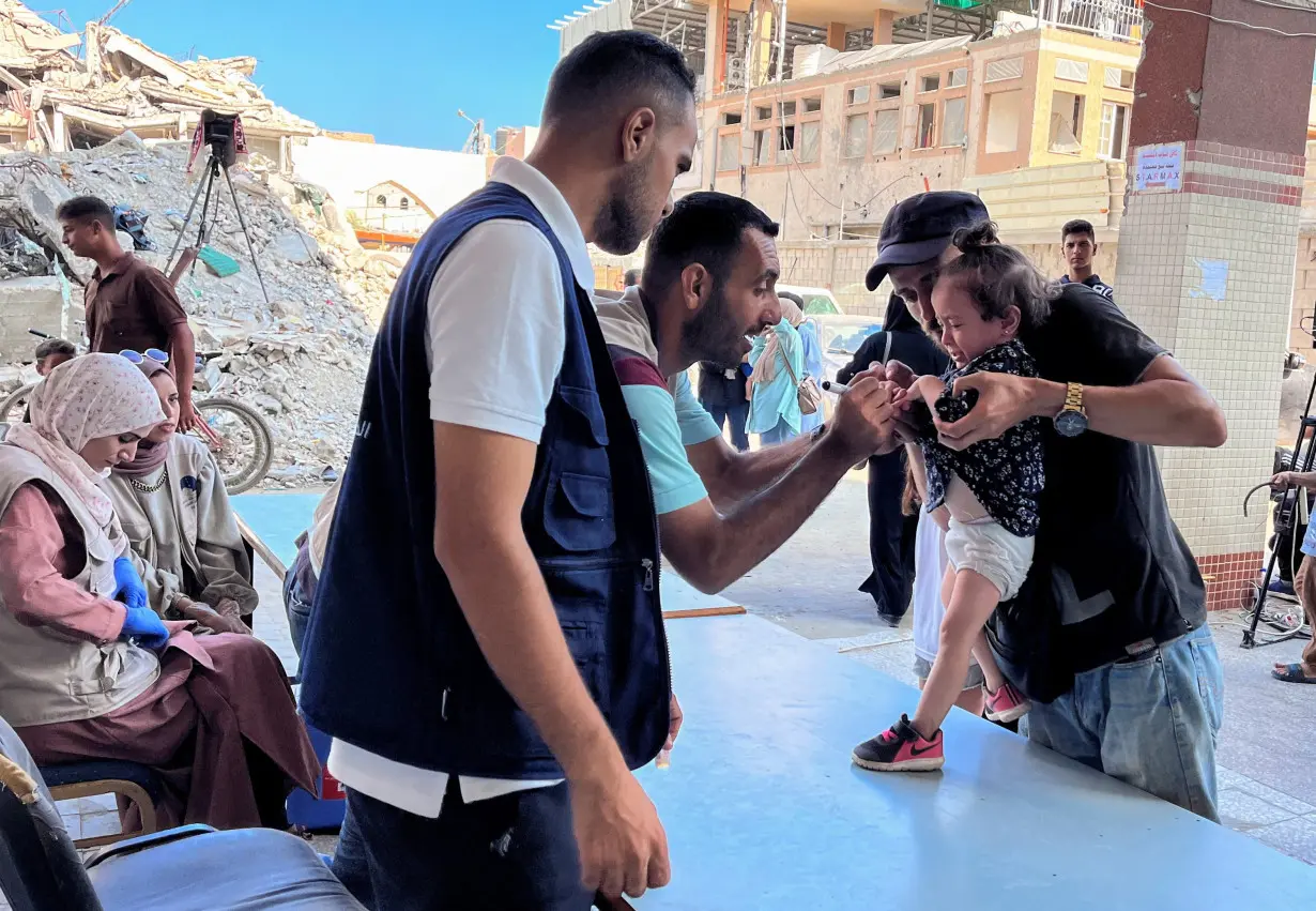 Palestinian children are vaccinated against polio, in Deir Al-Balah in the central Gaza Strip