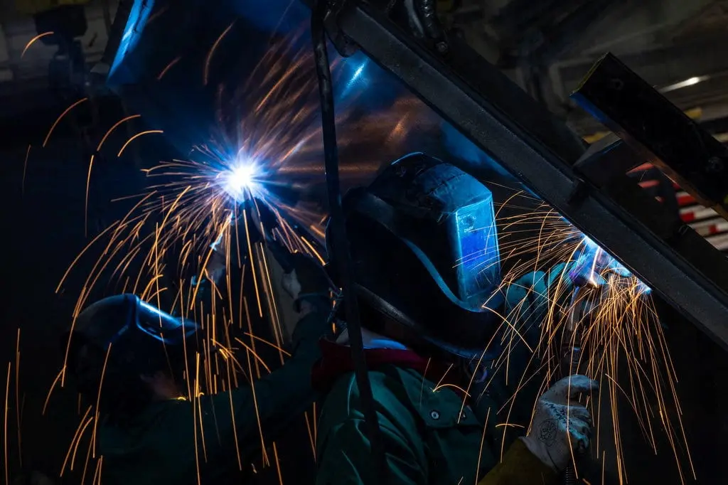 FILE PHOTO: Workers weld at a factory in Columbus, Ohio