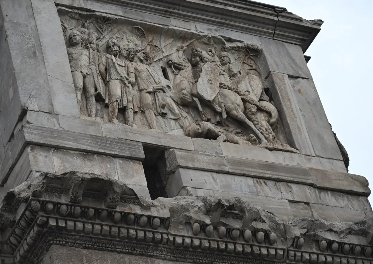 The damaged part of Constantine's Arch is seen after lightning struck it during a storm in Rome