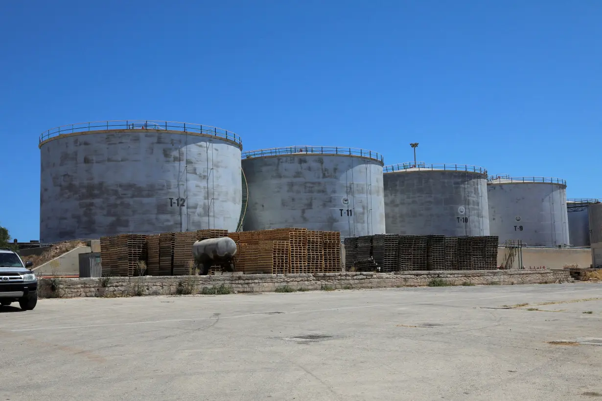 FILE PHOTO: Crude oil storage tanks are seen at Azzawiya oil refinery, in Zawiyah west of Tripoli