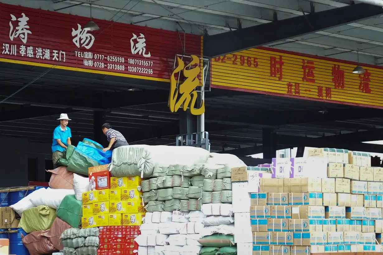 Employees work at a logistic centre in Yichang