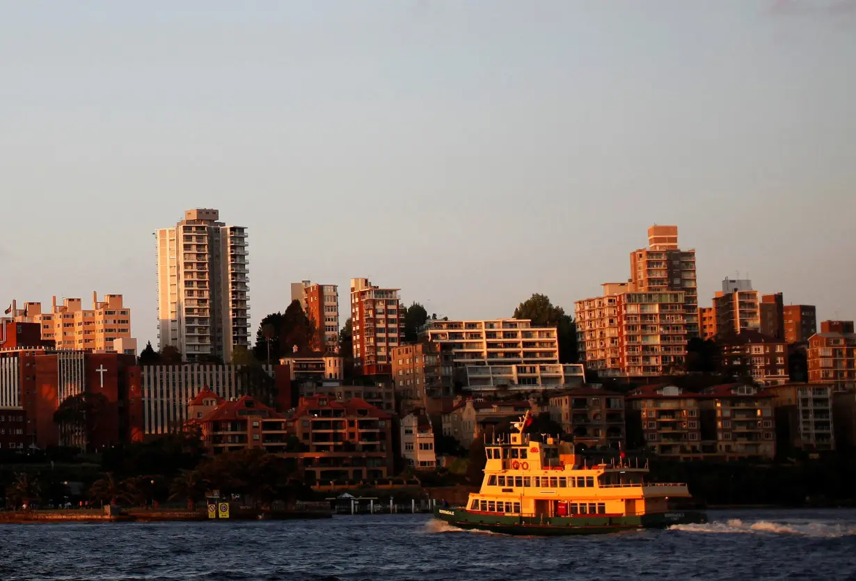 FILE PHOTO: A passenger ferry navigates in front of apartment buildings in Kirribilli after leaving Sydney's CBD