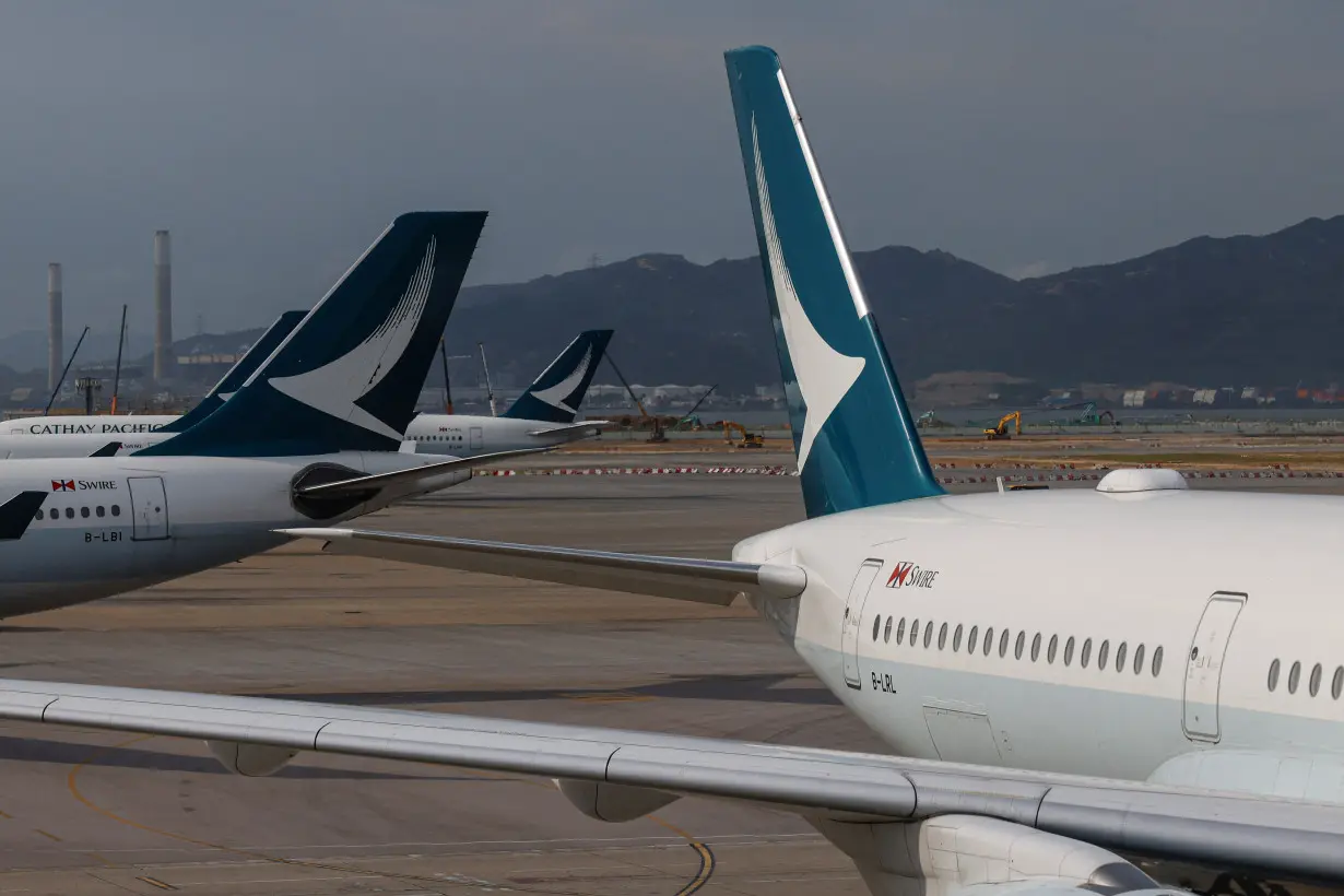 Cathay Pacific aircraft are seen parked at Hong Kong International Airport in Hong Kong