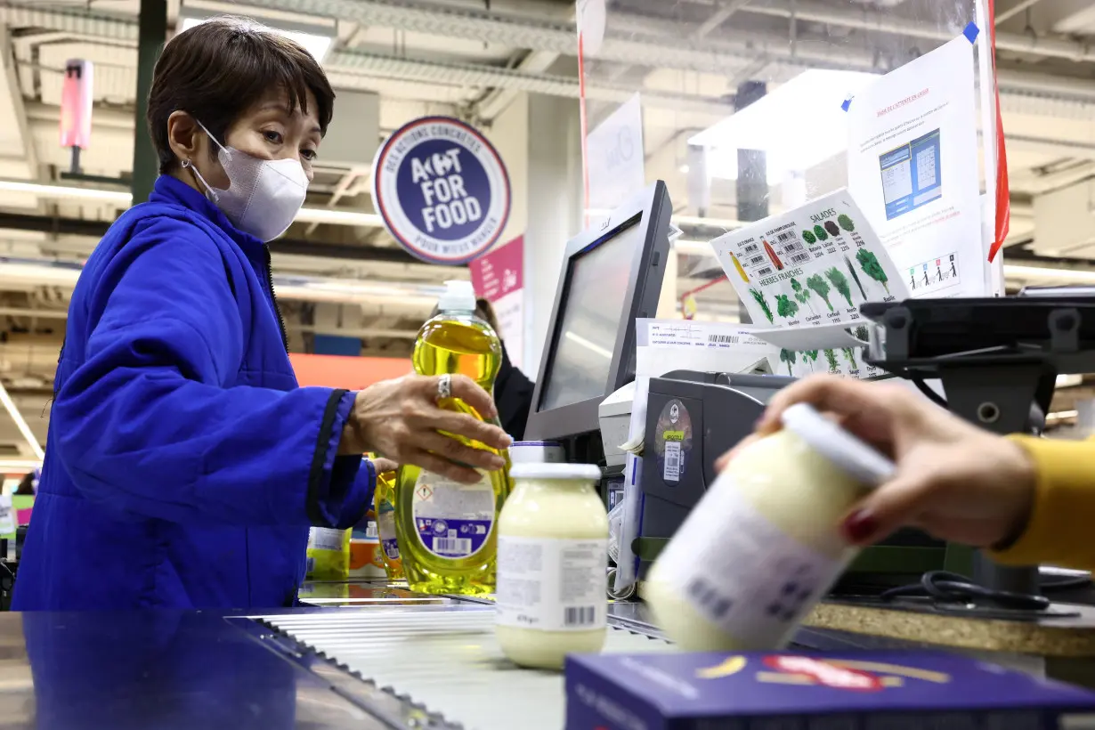 Customers shop in a Carrefour hypermarket in Paris