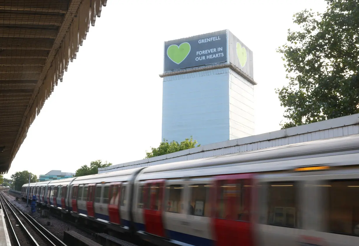 Covered remains of Grenfell Tower seen, as report from UK public inquiry into the deadly 2017 Grenfell fire published, in London