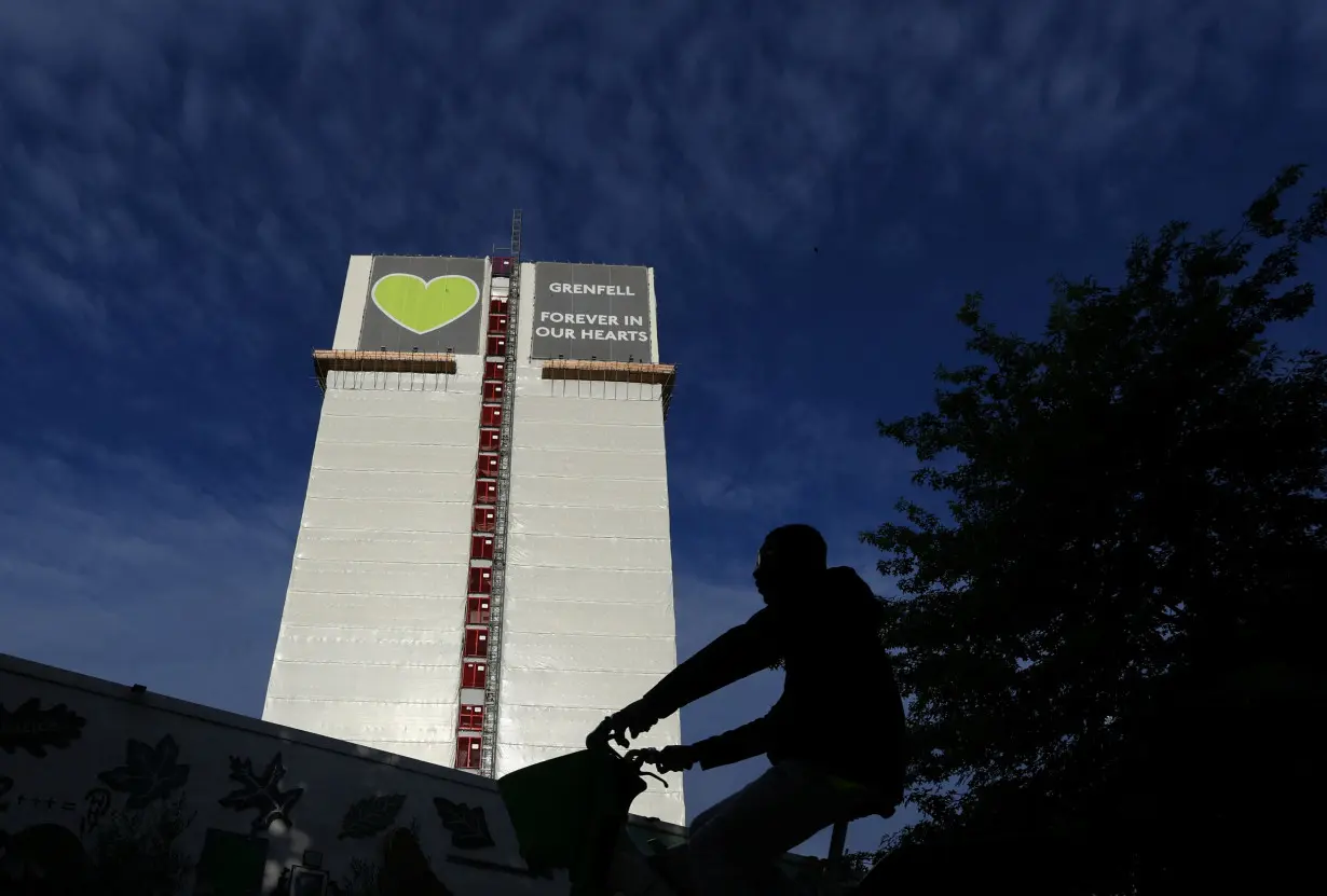 Covered remains of Grenfell Tower seen, as report from UK public inquiry into the deadly 2017 Grenfell fire published, in London