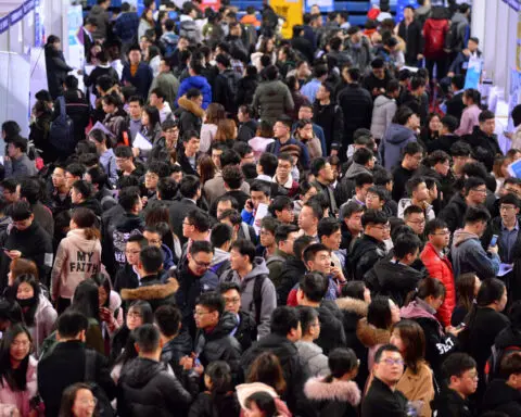 China warns students 'beautiful women, handsome guys' could lure them into spying
