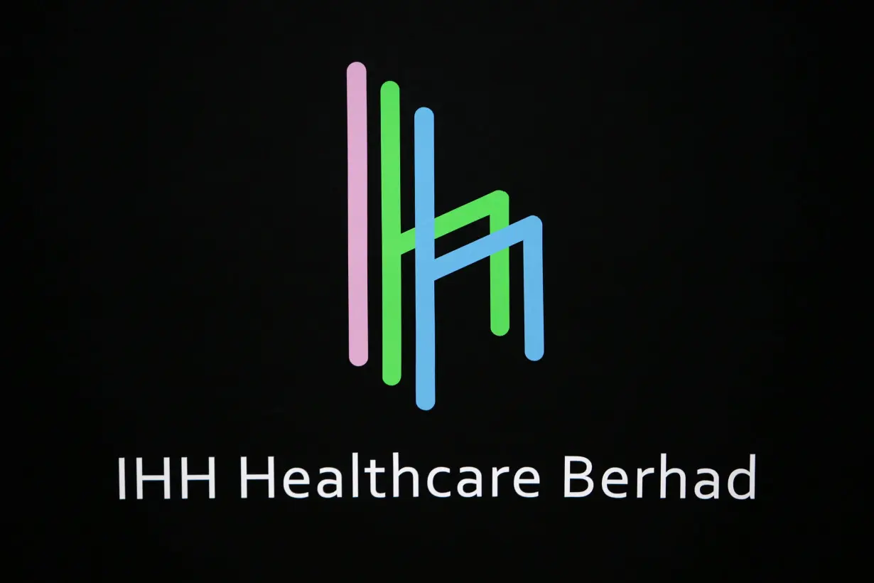 FILE PHOTO: The logo of IHH Healthcare Berhad is seen at the Singapore Exchange before its listing