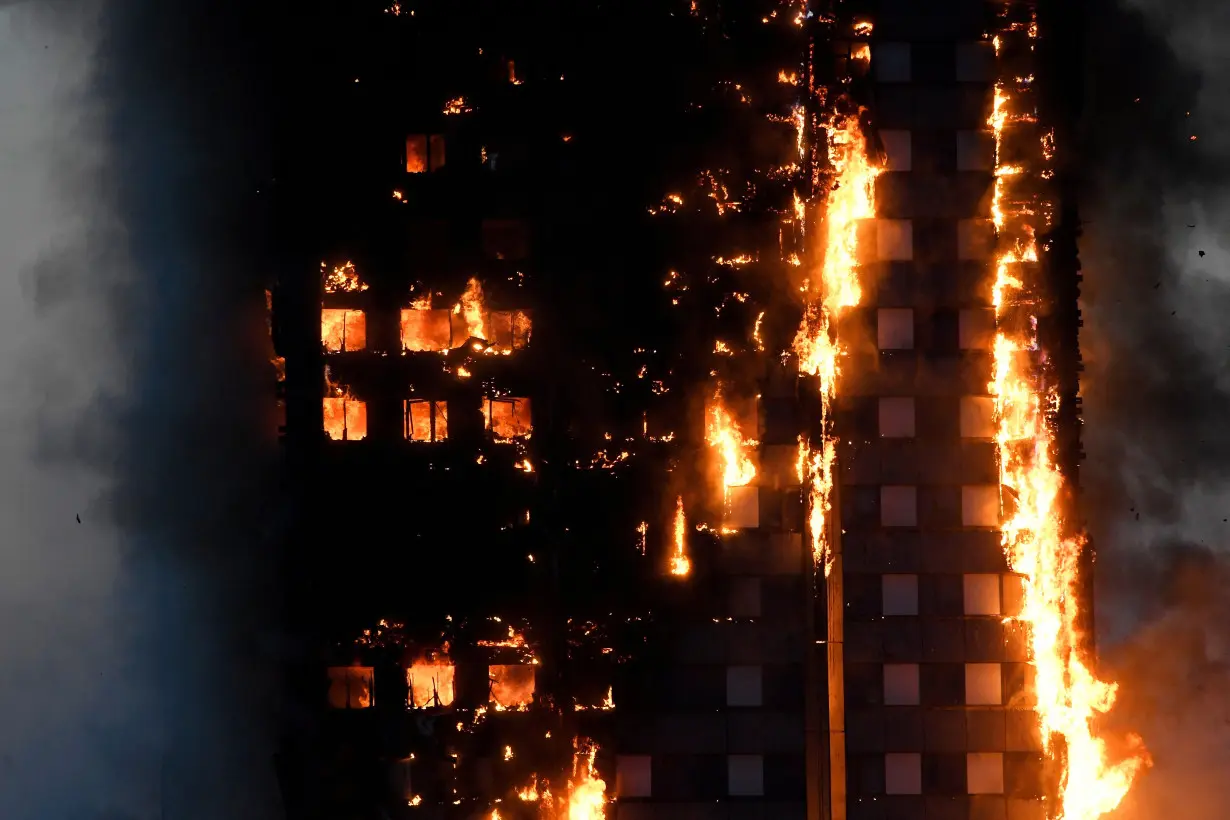 FILE PHOTO: The Grenfell Tower residential building is seen on fire in London