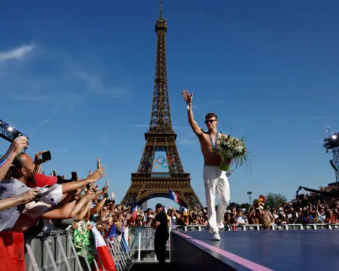 Paris mayor plans to keep Olympic rings on the Eiffel Tower. But not everyone is happy