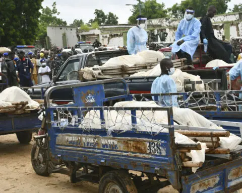 Boko Haram militants on motorcycles attacked a Nigerian village, killing over 100, residents say