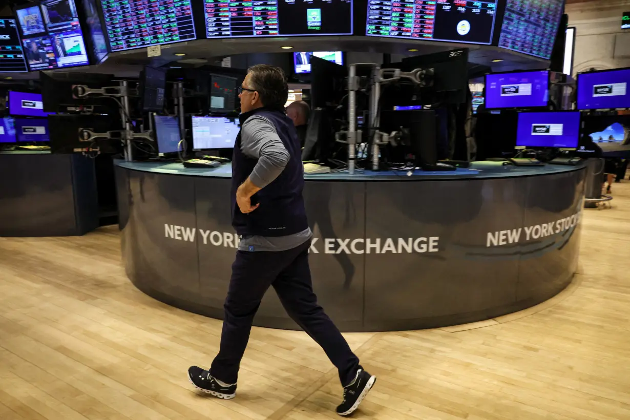 Traders work on the floor of the NYSE in New York