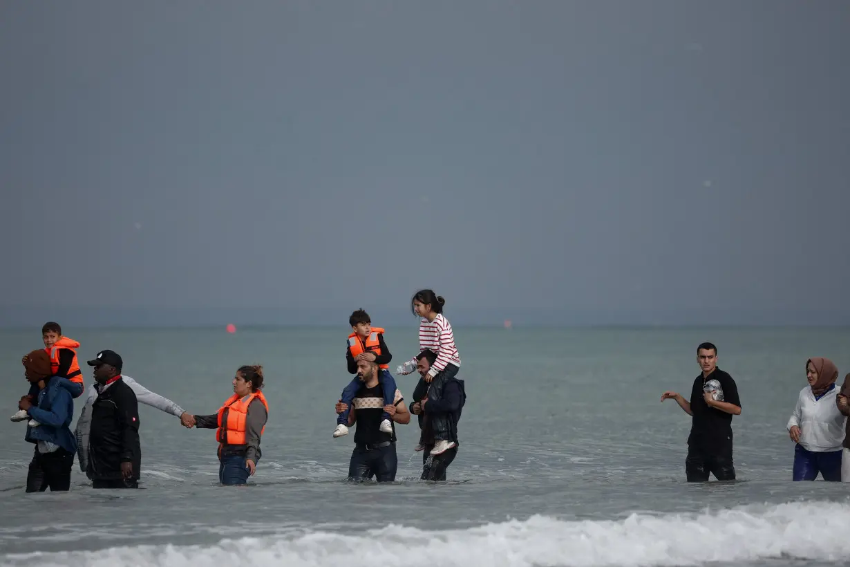 Migrants attempt to cross the English Channel, on the beach of the Slack dunes in Wimereux