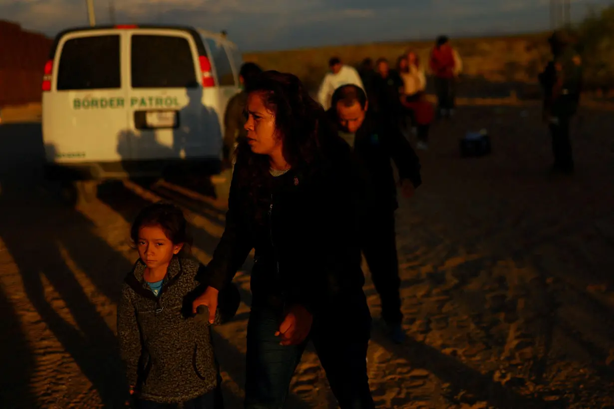 FILE PHOTO: Migrants are detained by U.S. Border Patrol agents in New Mexico