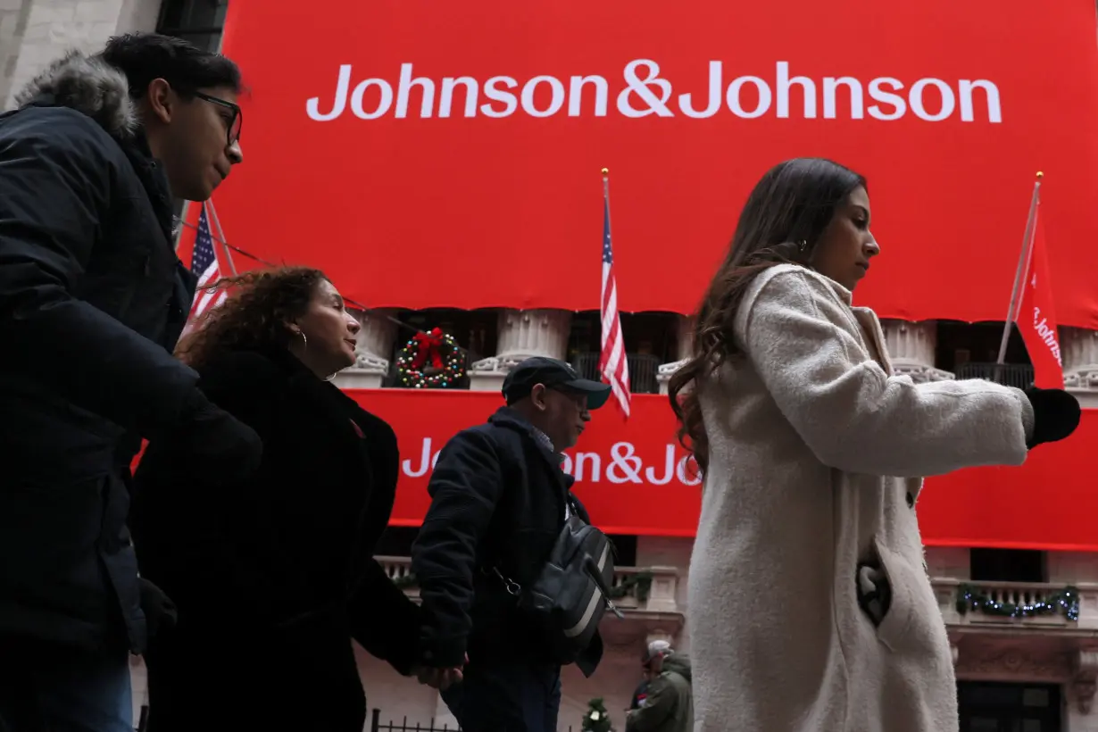 A Johnson & Johnson banner is displayed on the front of the NYSE in New York