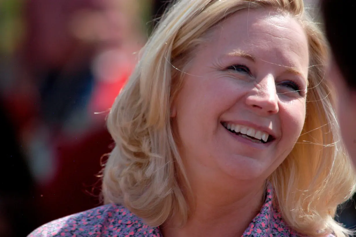 U.S. Senate candidate Liz Cheney speaks with voters during a Republican and Tea Party gathering in Emblem, Wyoming