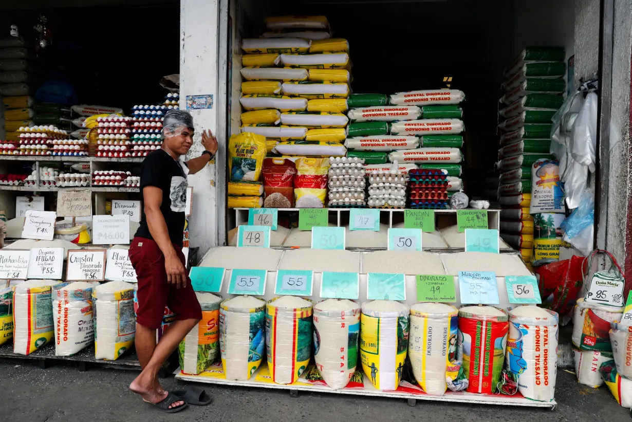 A vendor waits for customers at a rice and egg shop in Paranaque, Metro Manila