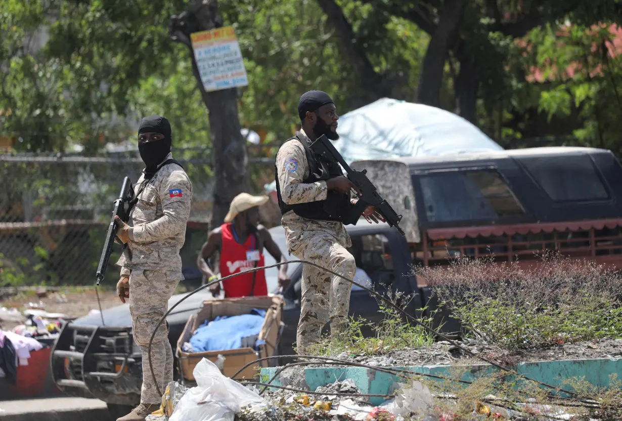 FILE PHOTO: Haiti's Prime Minister Garry Conille visits injured police officers at hospital, in Port-au-Prince