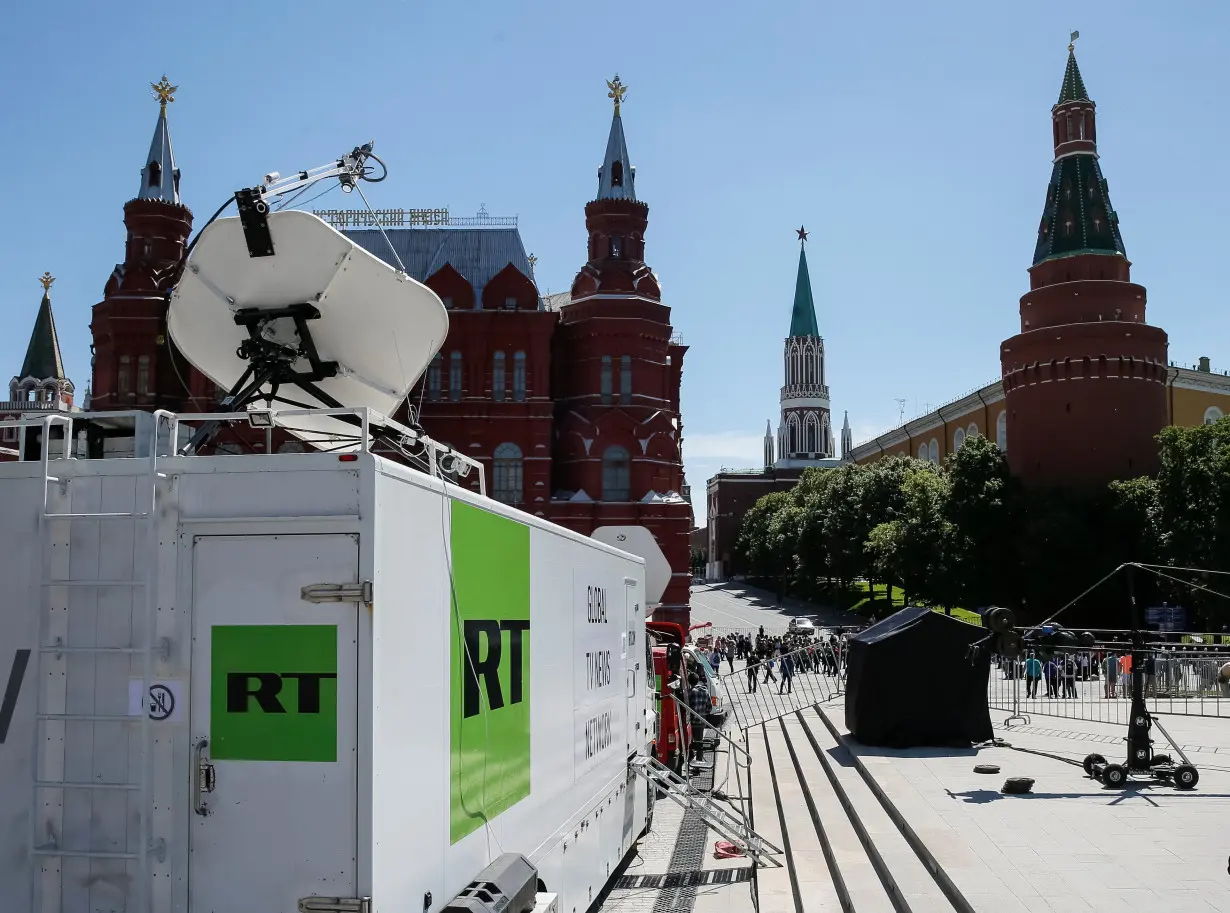 Vehicles of Russian state-controlled broadcaster Russia Today are seen near the Red Square in central Moscow