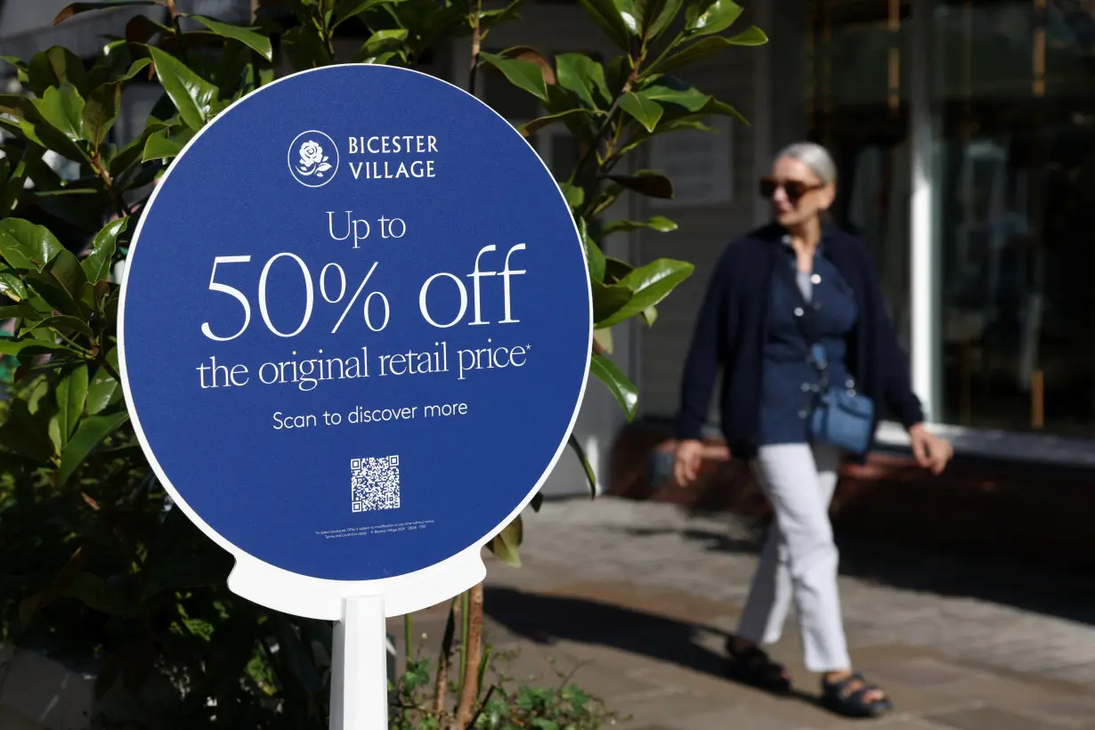 People shop at designer outlet stores at Bicester Village