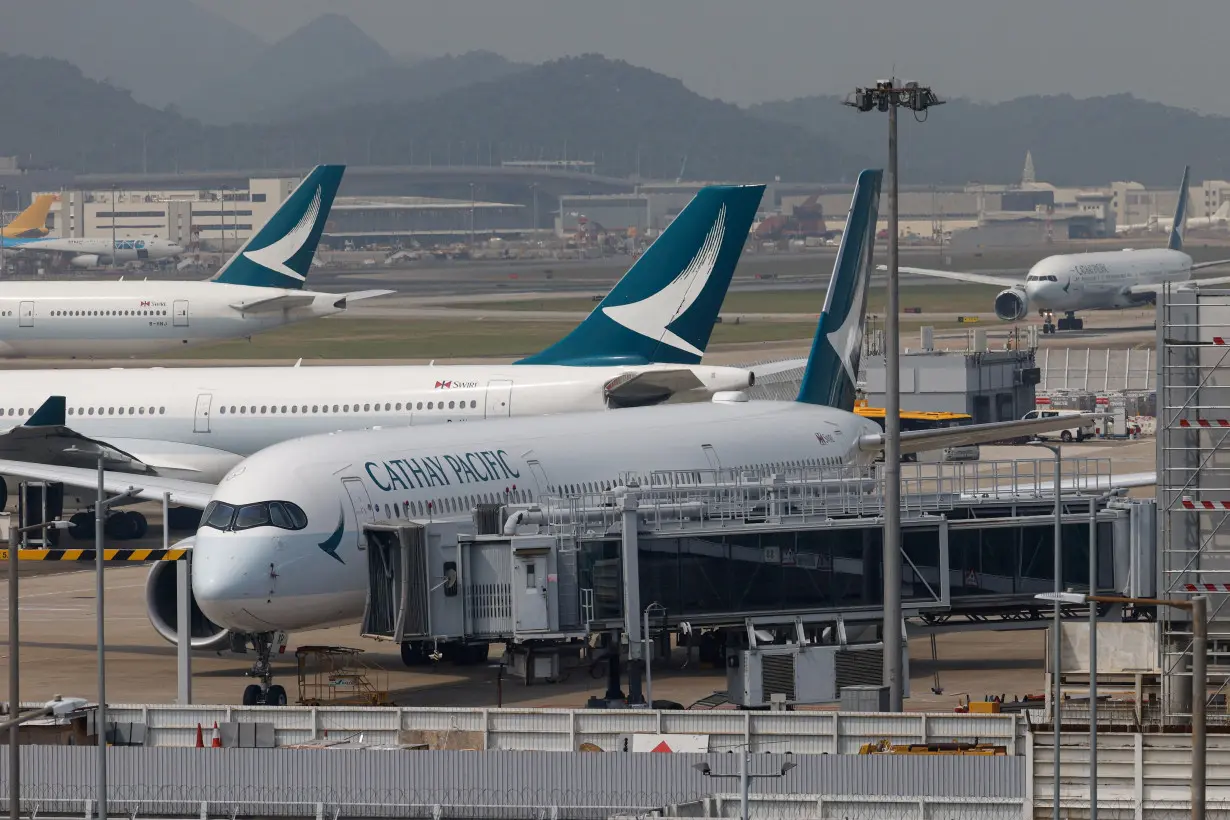 FILE PHOTO: A Cathay Pacific Airbus A350 aircraft is seen in Hong Kong International Airport, in Hong Kong