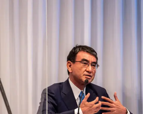 Japan prime minister hopeful Kono says govts should not intervene in deals