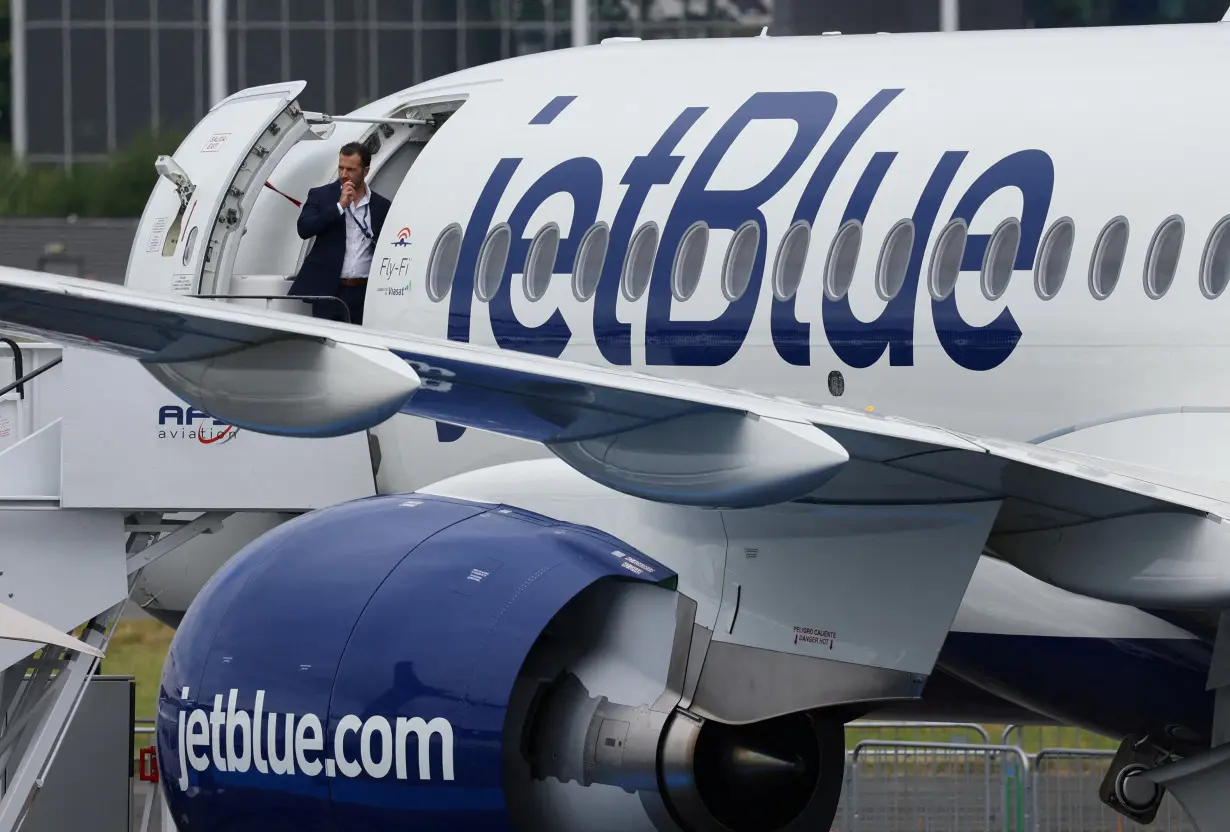 FILE PHOTO: Branding for JetBlue Airlines is seen at Farnborough International Airshow, in Farnborough