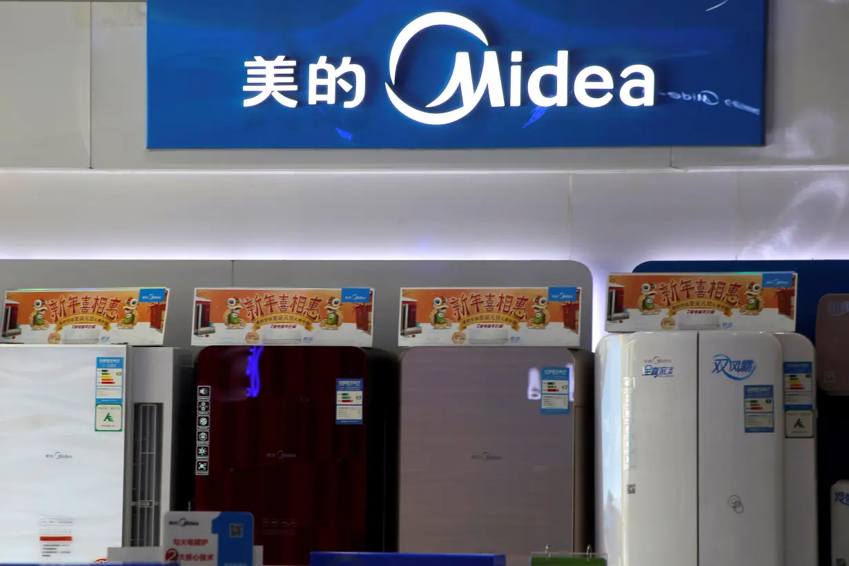 Products of Midea are seen at a shop in Beijing