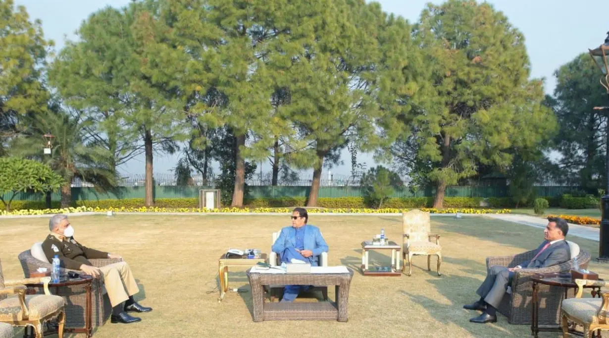 FILE PHOTO: Chief of Army Staff General Qamar Javed Bajwa and D.G ISI Lt. General Faiz Hamid call on Prime minister Imran Khan in Islamabad