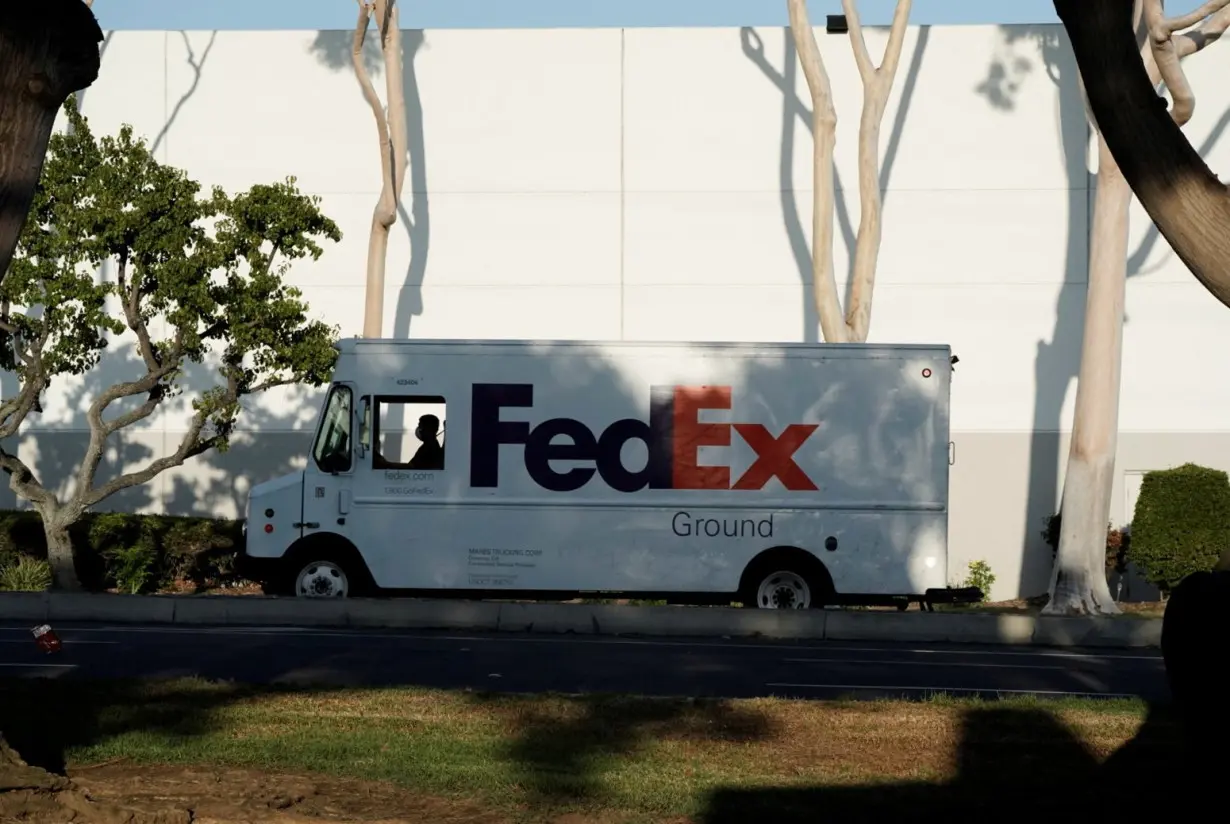 FILE PHOTO: FedEx last-mile delivery van is seen near a FedEx Ground distribution center