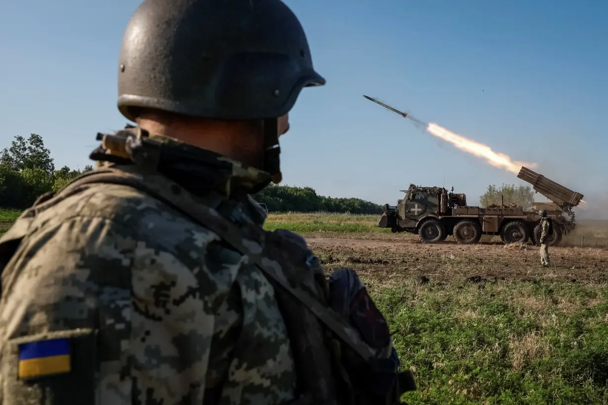 Ukrainian service members fire a RM-70 Vampire multiple launch rocket system towards Russian troops, at a position near a front line in Donetsk region