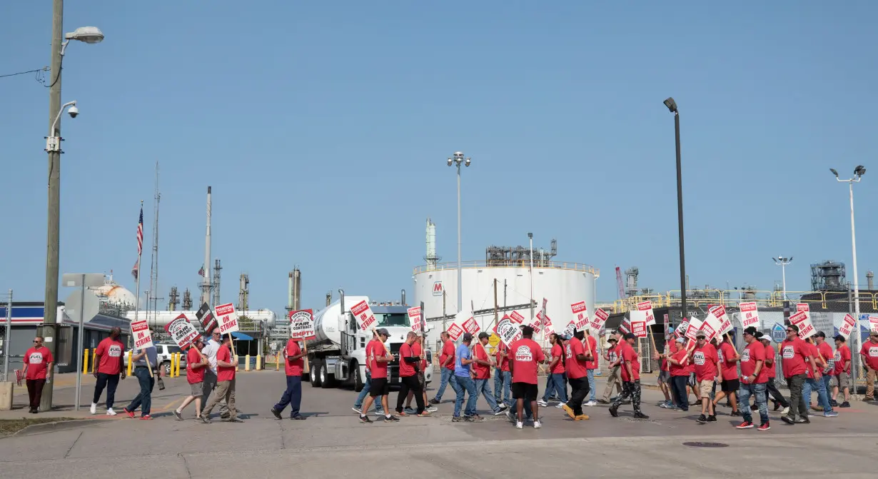 Workers on strike at Marathon Petroleum's (MPC.N) Detroit refinery walk the picket line in Detroit