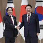 Japan's leader makes farewell visit to South Korea to strengthen his legacy of warming ties