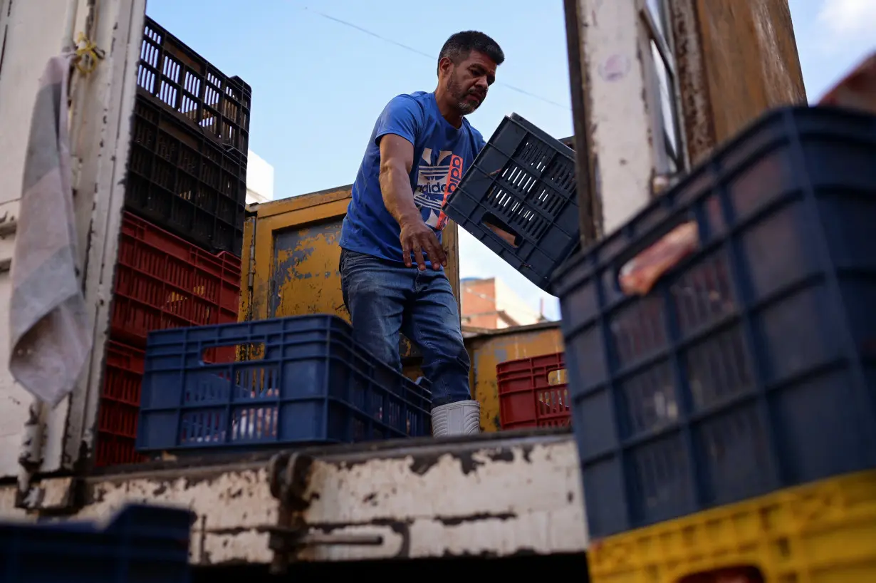 People go about their lives amid ongoing dispute over July's presidential election, in Caracas