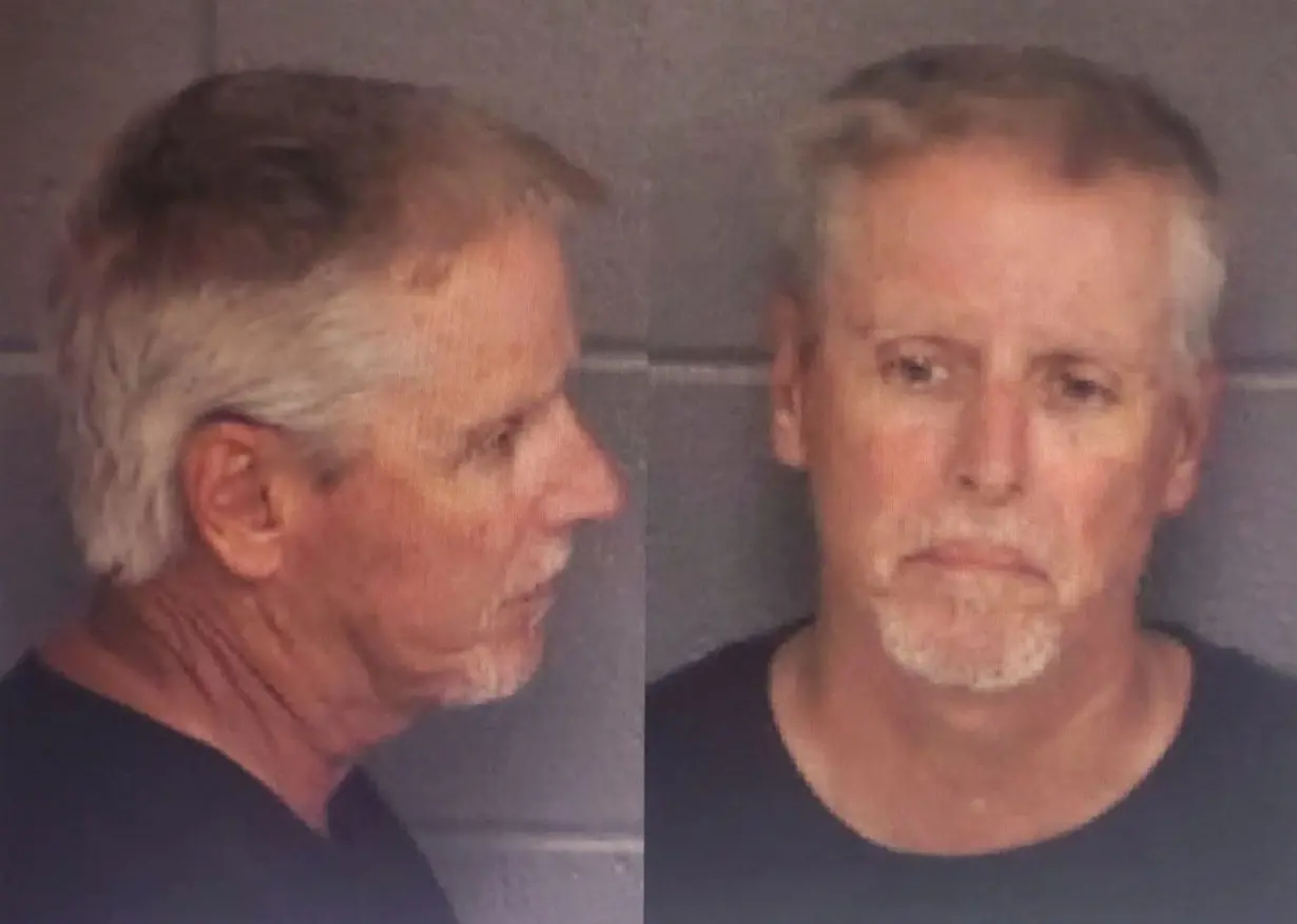 Colin Gray, 54, father of 14-year-old suspected Apalachee High School shooter Colt Gray, poses for police booking photos